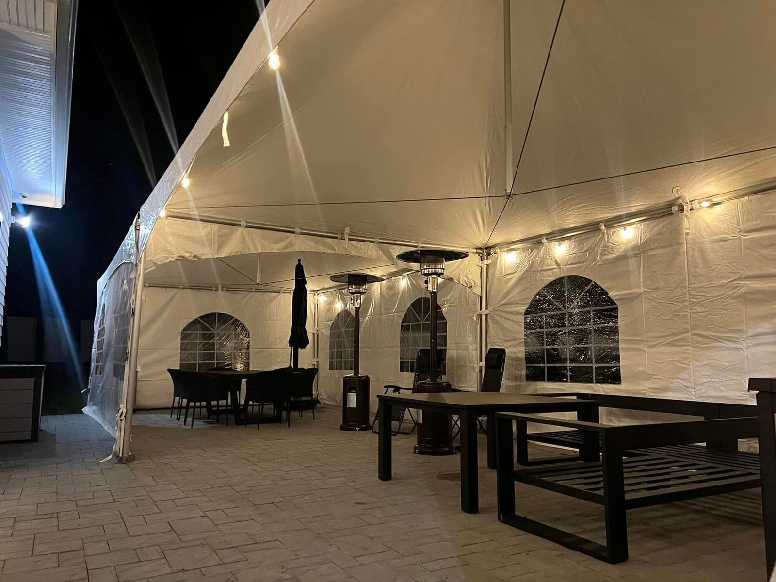 15 by 40 high-peak tent: Sides on, tables inside