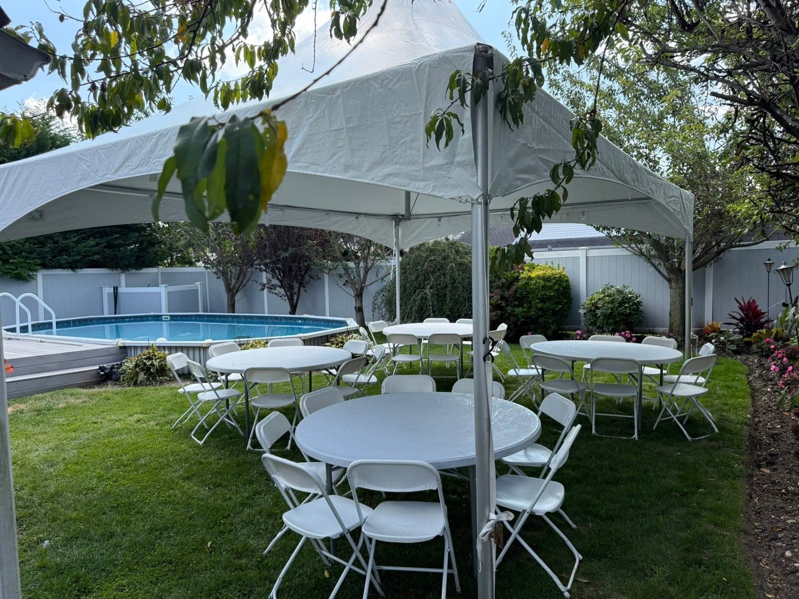 20 by 20 high-peak tent: Rounds set on the grass