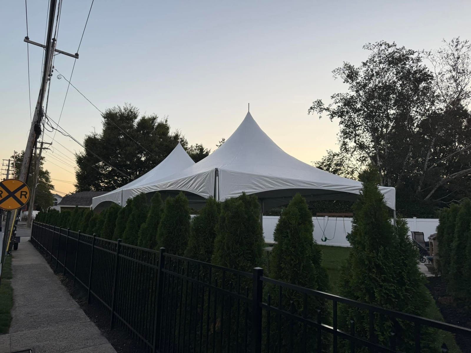 20 by 20 high-peak tent: Dusk on the lawn