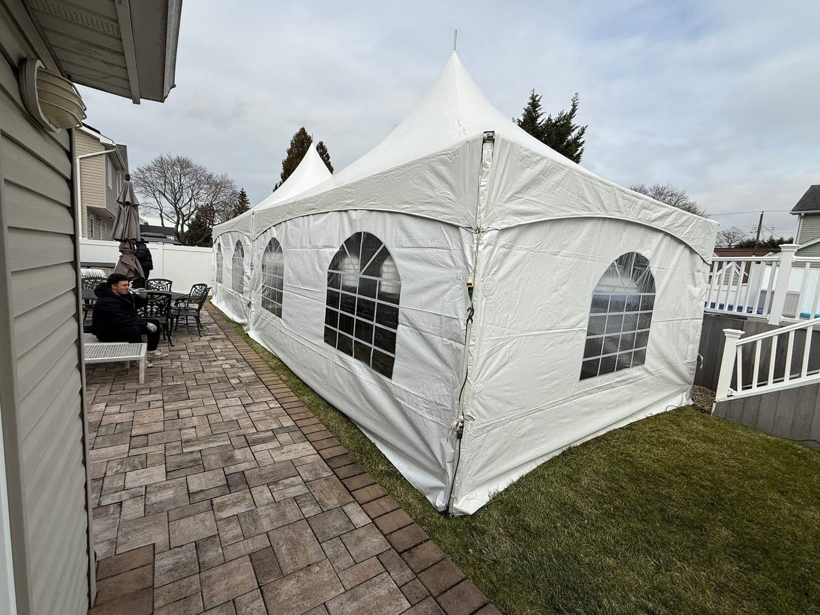 20 by 20 high-peak tent: Sides on, driveway edge