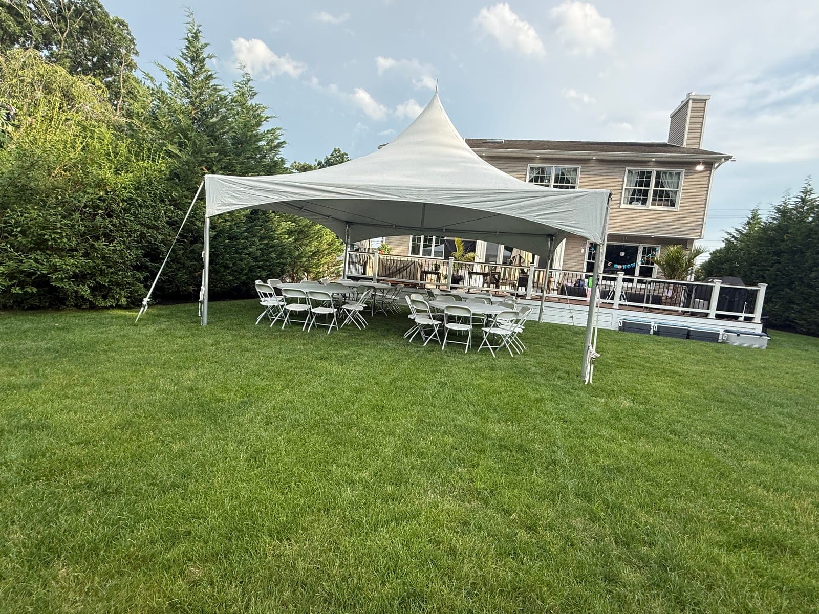 20 by 20 high-peak tent: 20×20 on the back lawn, tables and chairs