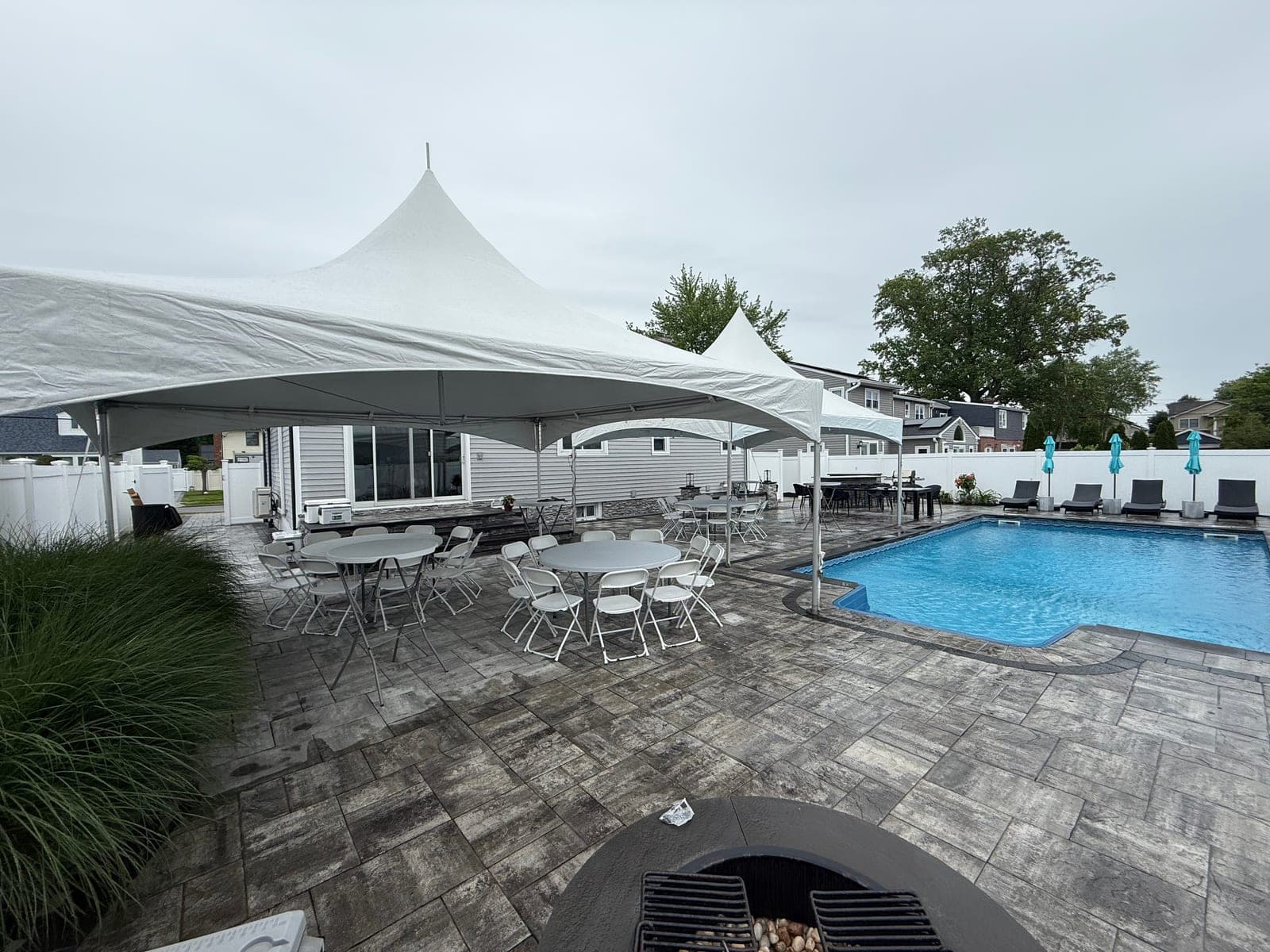 20 by 20 high-peak tent: 20×20 and 15×20 side by side over the pool deck
