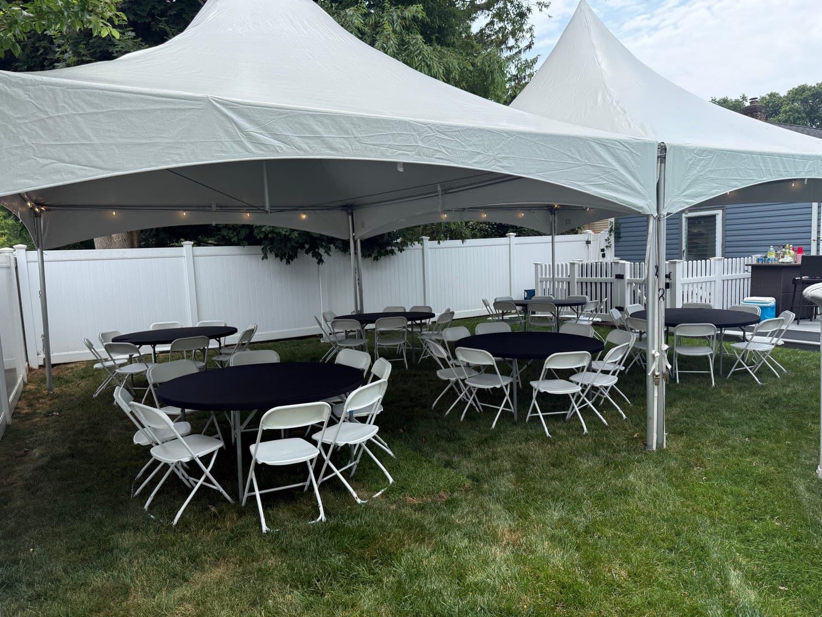20 by 40 high-peak tent: 20×40 with rounds and navy linens